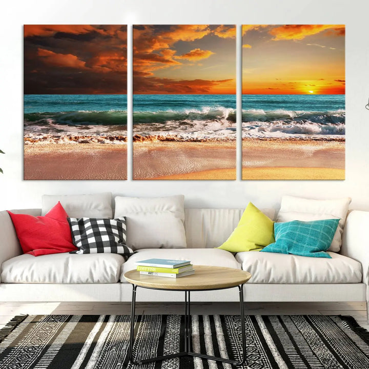 The living room features the stunning Golden Sunset Beach Canvas Wall Art—Triptych Seascape Print—framed and ready to hang on the wall.