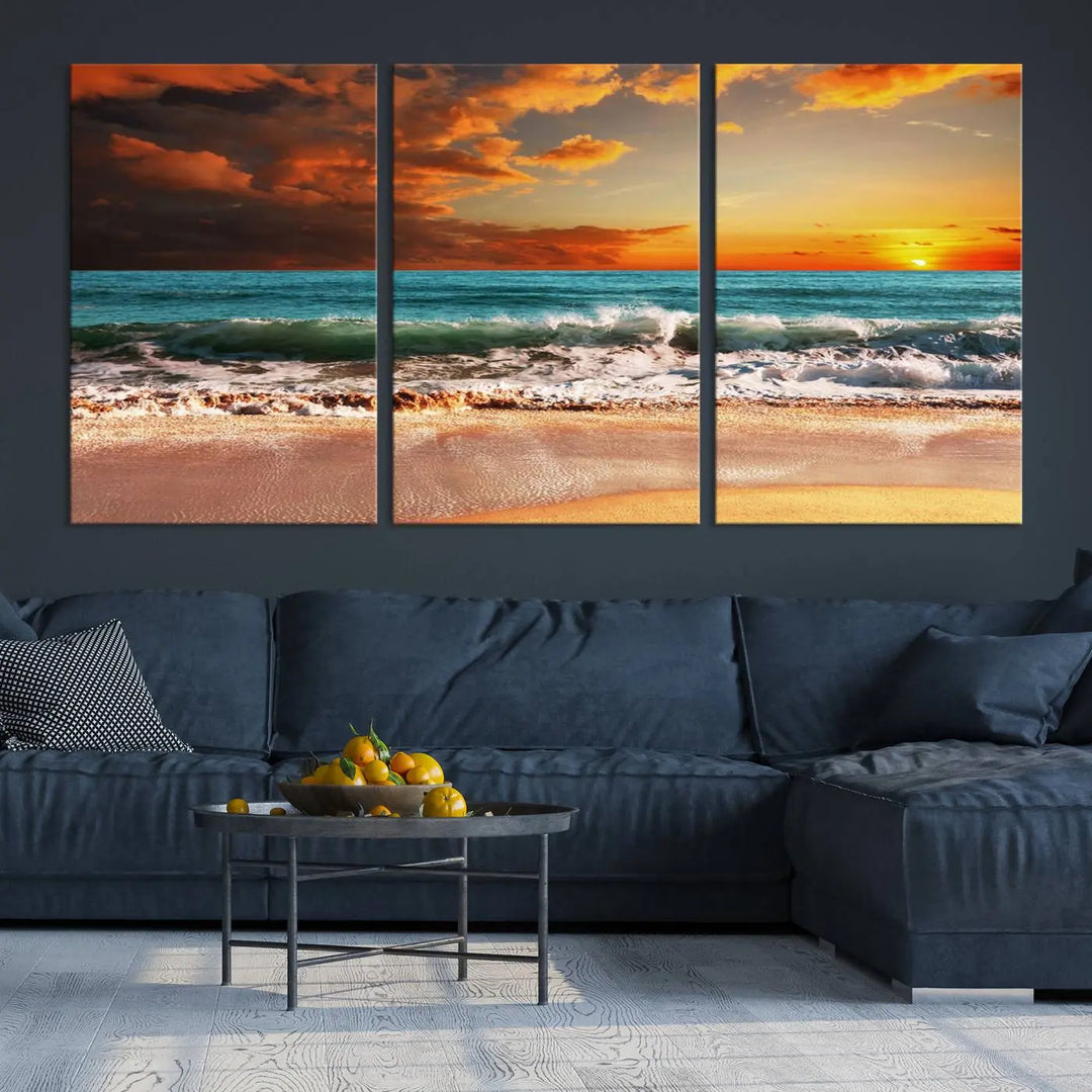 The living room features the stunning Golden Sunset Beach Canvas Wall Art—Triptych Seascape Print—framed and ready to hang on the wall.