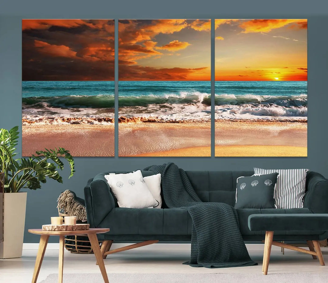 The living room features the stunning Golden Sunset Beach Canvas Wall Art—Triptych Seascape Print—framed and ready to hang on the wall.