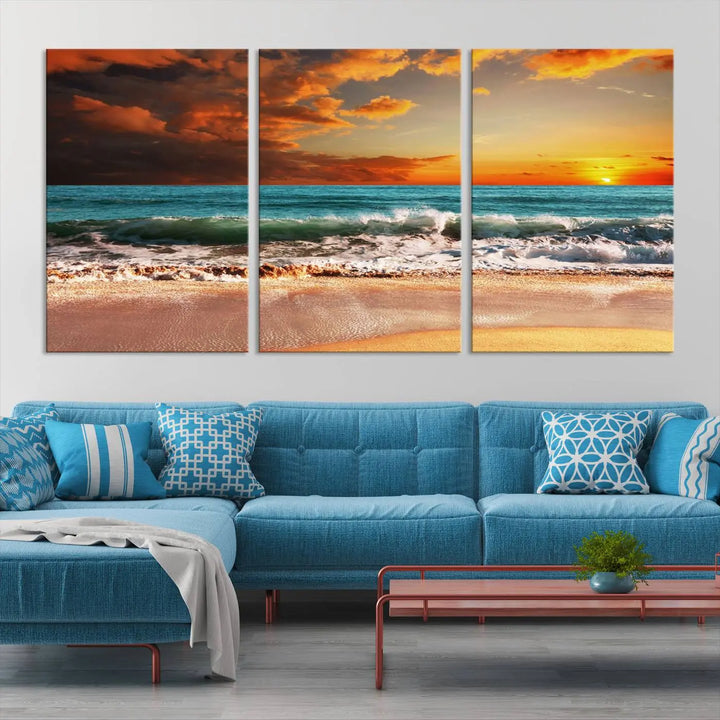 The living room features the stunning Golden Sunset Beach Canvas Wall Art—Triptych Seascape Print—framed and ready to hang on the wall.