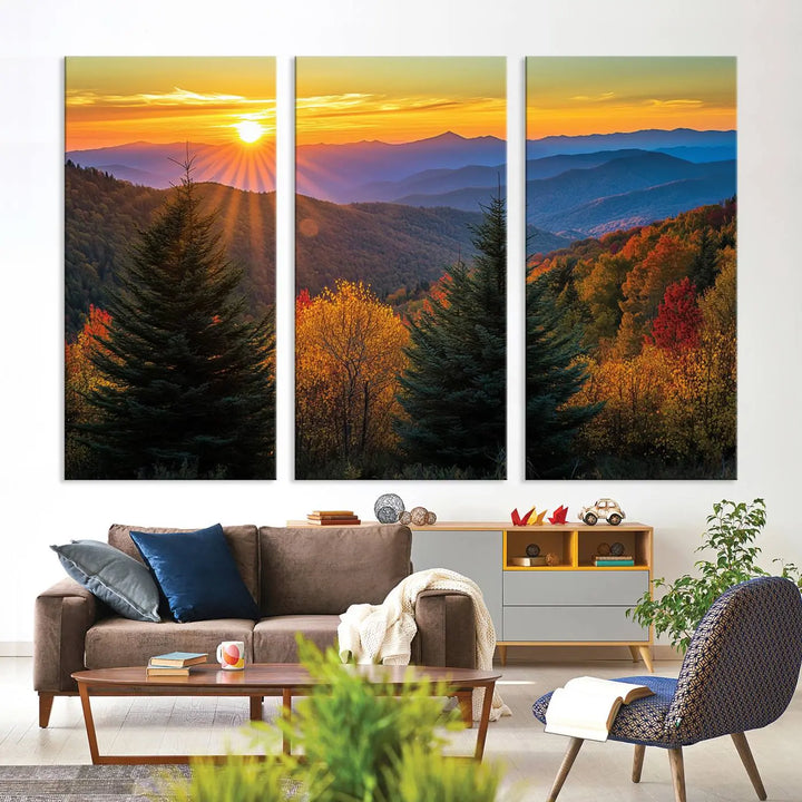 A living room featuring a Golden Sunset Over Mountain Forest canvas wall art.