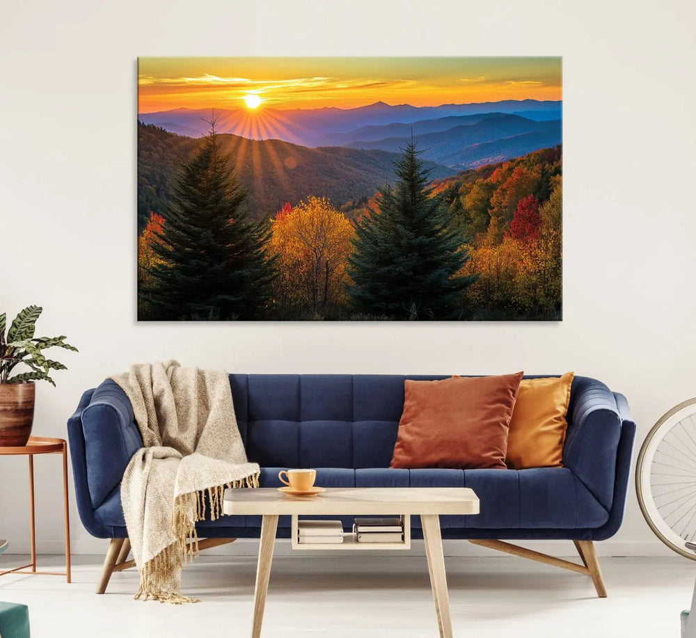 A living room featuring a Golden Sunset Over Mountain Forest canvas wall art.