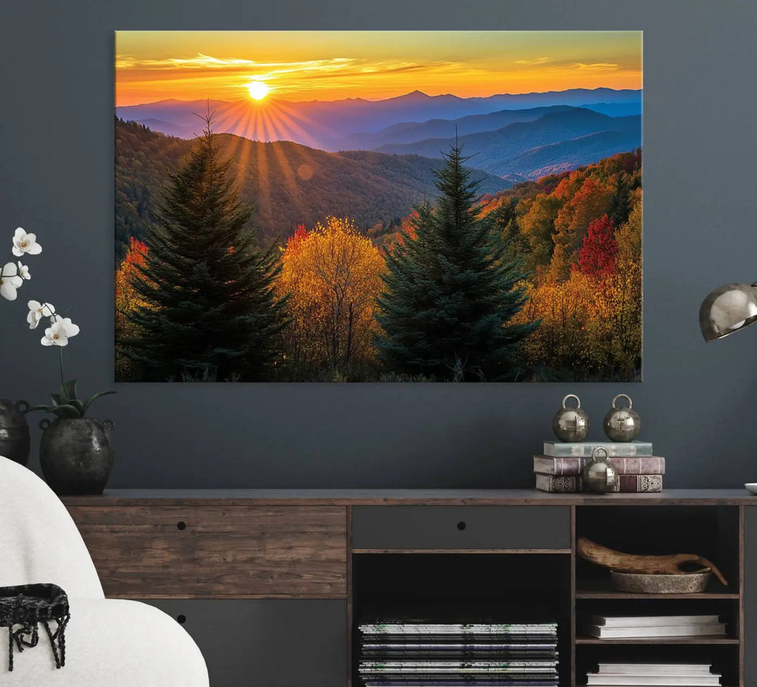 A living room featuring a Golden Sunset Over Mountain Forest canvas wall art.