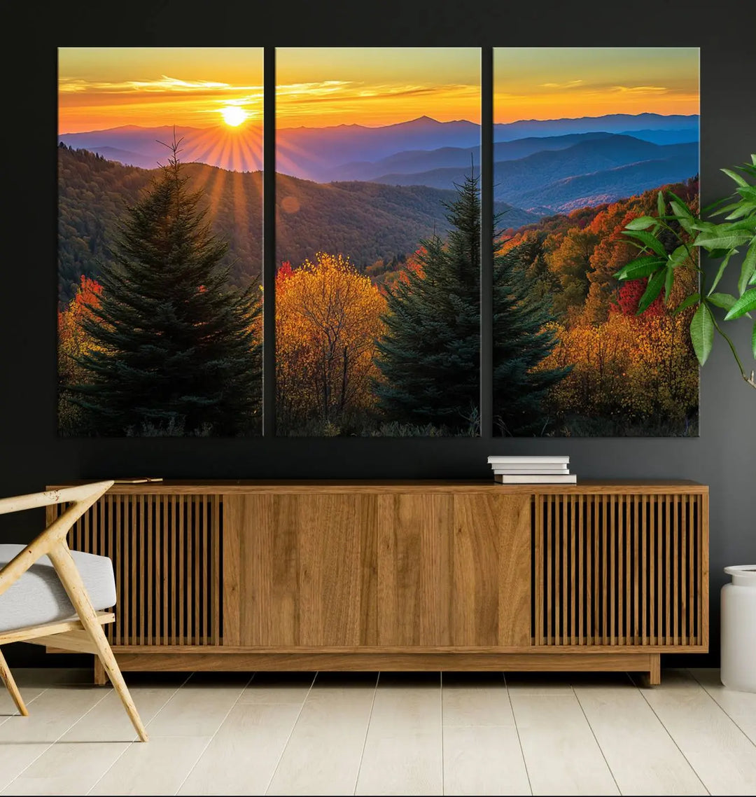 A living room featuring a Golden Sunset Over Mountain Forest canvas wall art.