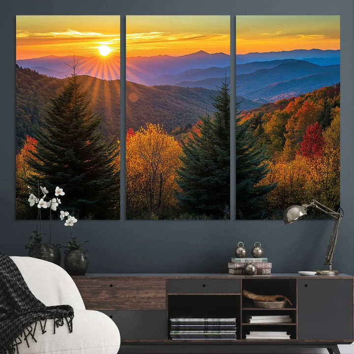 A living room featuring a Golden Sunset Over Mountain Forest canvas wall art.