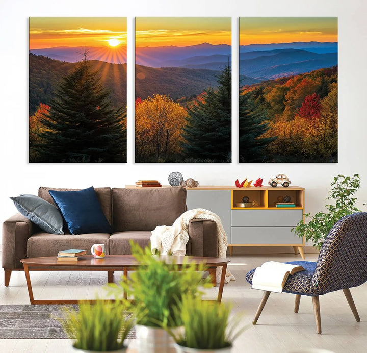 A living room featuring a Golden Sunset Over Mountain Forest canvas wall art.