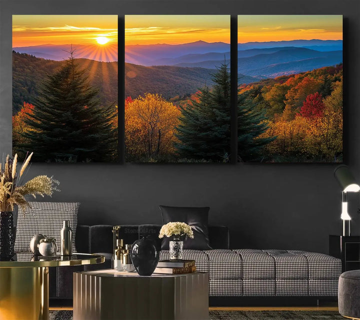 A living room featuring a Golden Sunset Over Mountain Forest canvas wall art.