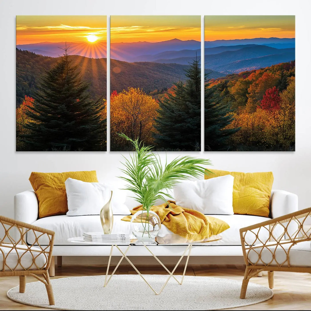 A living room featuring a Golden Sunset Over Mountain Forest canvas wall art.