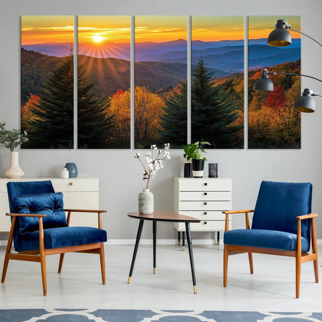 A living room featuring a Golden Sunset Over Mountain Forest canvas wall art.