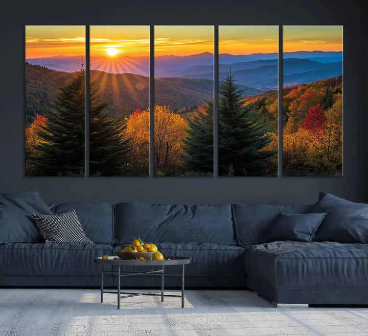 A living room featuring a Golden Sunset Over Mountain Forest canvas wall art.