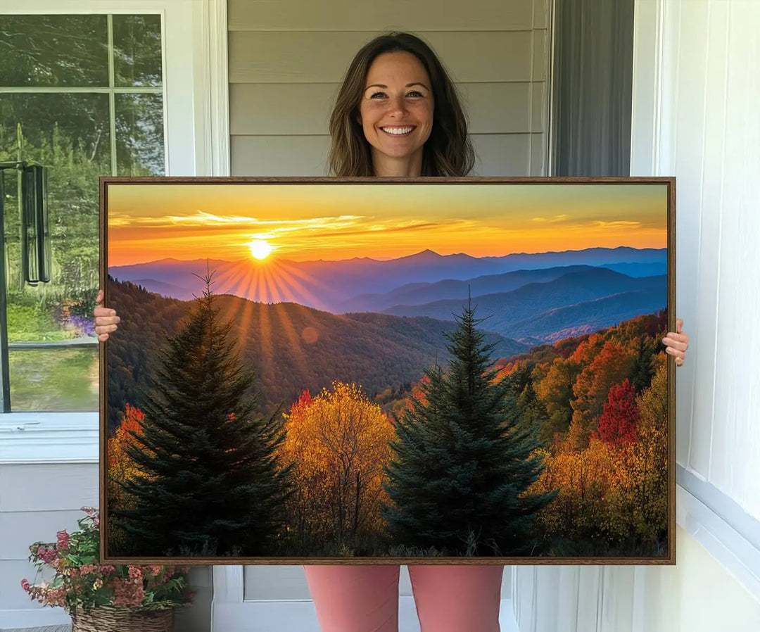 A living room featuring a Golden Sunset Over Mountain Forest canvas wall art.