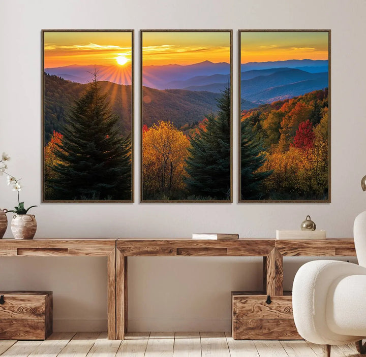 A living room featuring a Golden Sunset Over Mountain Forest canvas wall art.