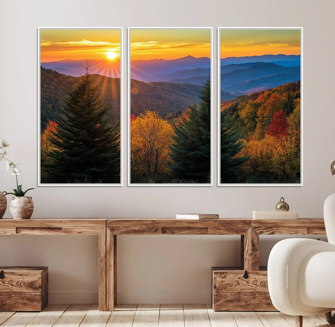 A living room featuring a Golden Sunset Over Mountain Forest canvas wall art.