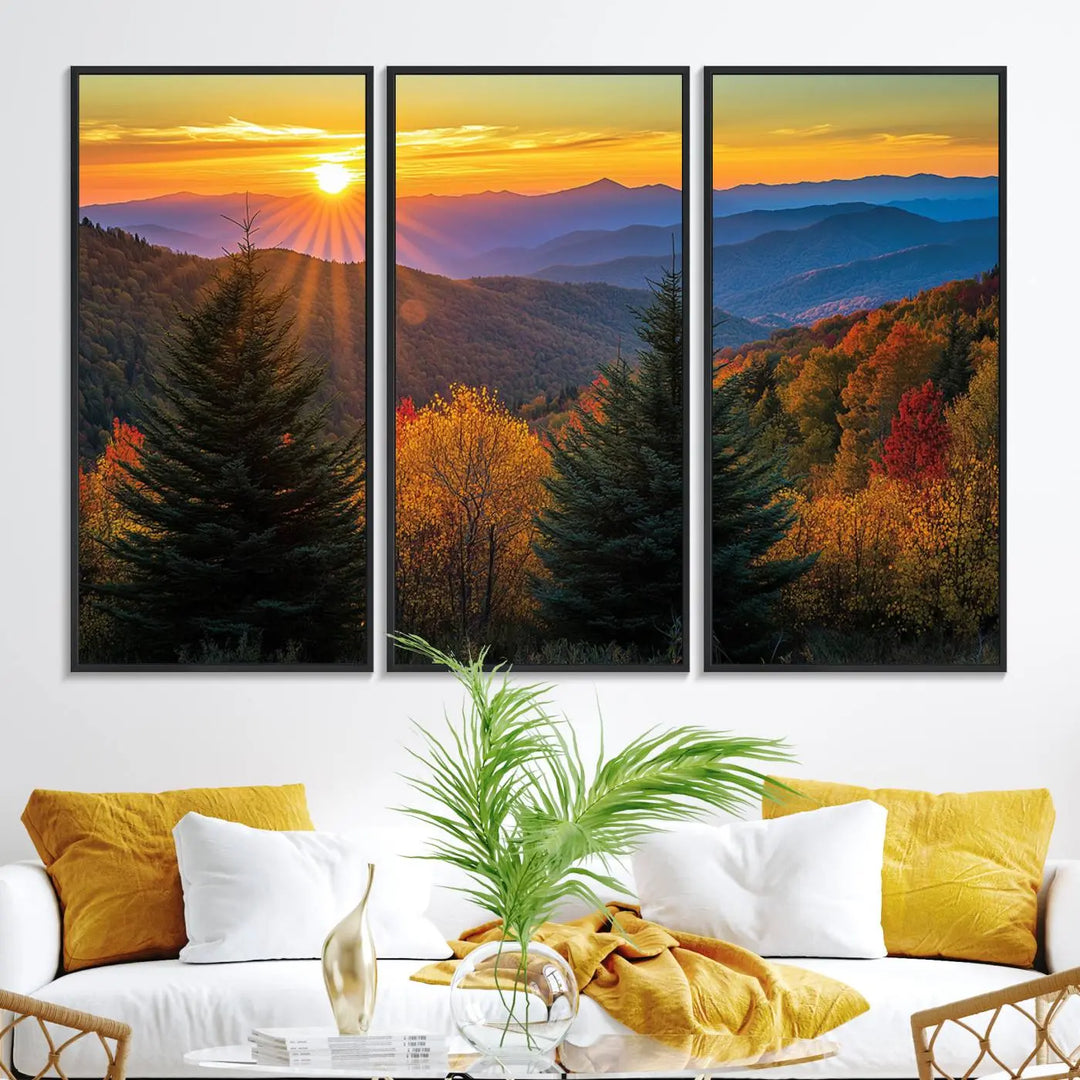 A living room featuring a Golden Sunset Over Mountain Forest canvas wall art.