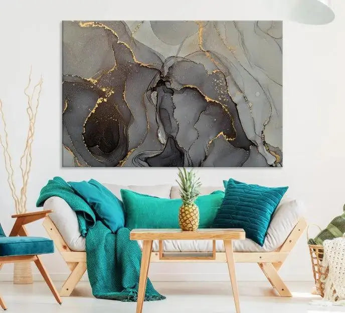 The Gray Marble Fluid Effect Wall Art Abstract Canvas Wall Art Print is a museum-quality canvas featuring triptych abstract art with swirling gray and gold patterns. Complete with a UV-protective coating, this piece of artwork arrives ready to hang, effortlessly elevating your living space.