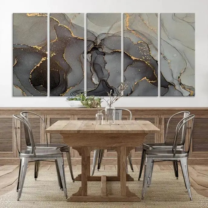 The Gray Marble Fluid Effect Wall Art Abstract Canvas Wall Art Print is a museum-quality canvas featuring triptych abstract art with swirling gray and gold patterns. Complete with a UV-protective coating, this piece of artwork arrives ready to hang, effortlessly elevating your living space.