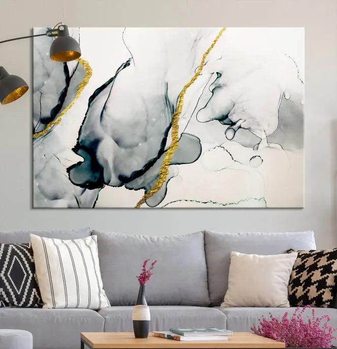 Gray Marble Fluid Effect Wall Art Abstract Canvas Wall Art Print features intricate gray and gold lines on museum-quality canvas. This ready-to-hang artwork includes a UV-protective coating to maintain its vibrant appearance.