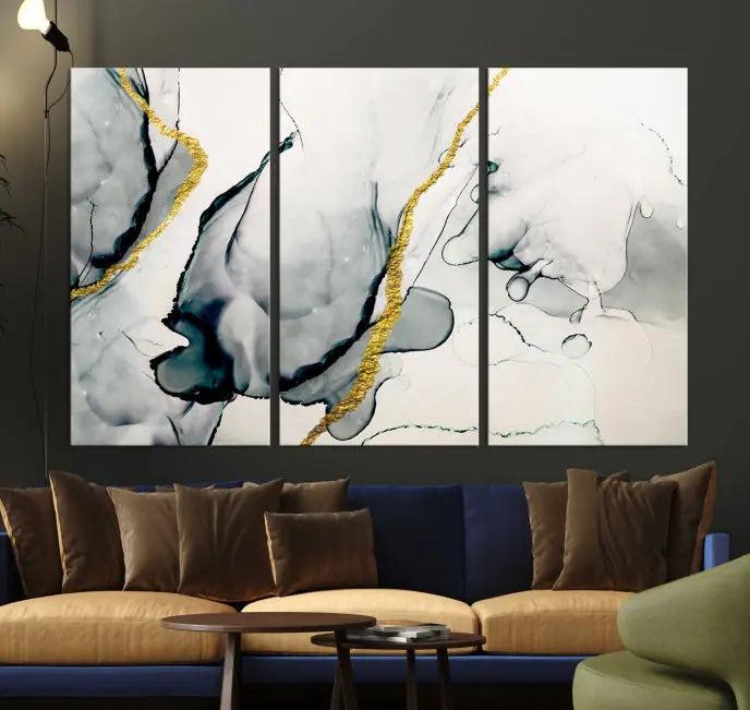 Gray Marble Fluid Effect Wall Art Abstract Canvas Wall Art Print features intricate gray and gold lines on museum-quality canvas. This ready-to-hang artwork includes a UV-protective coating to maintain its vibrant appearance.