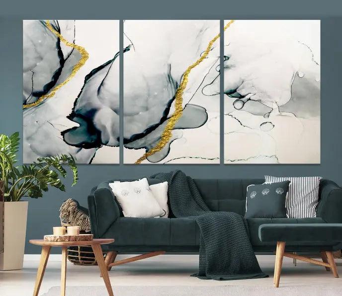 Gray Marble Fluid Effect Wall Art Abstract Canvas Wall Art Print features intricate gray and gold lines on museum-quality canvas. This ready-to-hang artwork includes a UV-protective coating to maintain its vibrant appearance.