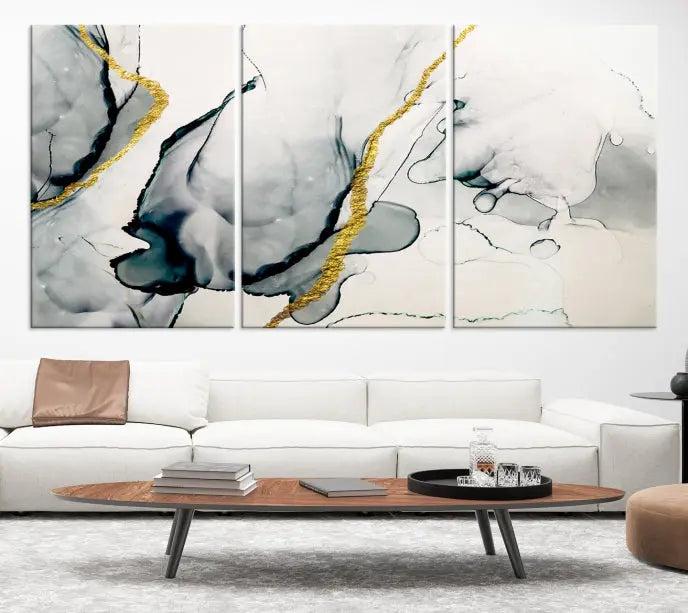 Gray Marble Fluid Effect Wall Art Abstract Canvas Wall Art Print features intricate gray and gold lines on museum-quality canvas. This ready-to-hang artwork includes a UV-protective coating to maintain its vibrant appearance.