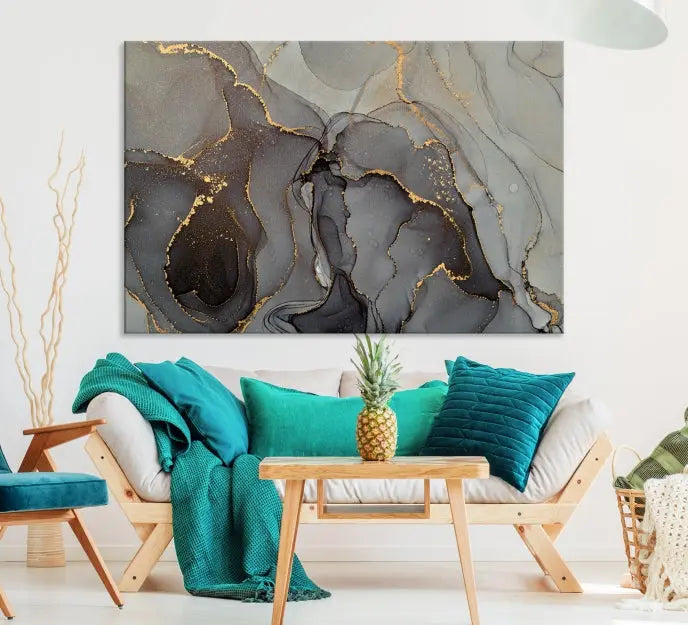 The Gray Marble Fluid Effect Wall Art Abstract Canvas Wall Art Print is a museum-quality canvas featuring triptych abstract art with swirling gray and gold patterns. Complete with a UV-protective coating, this piece of artwork arrives ready to hang, effortlessly elevating your living space.