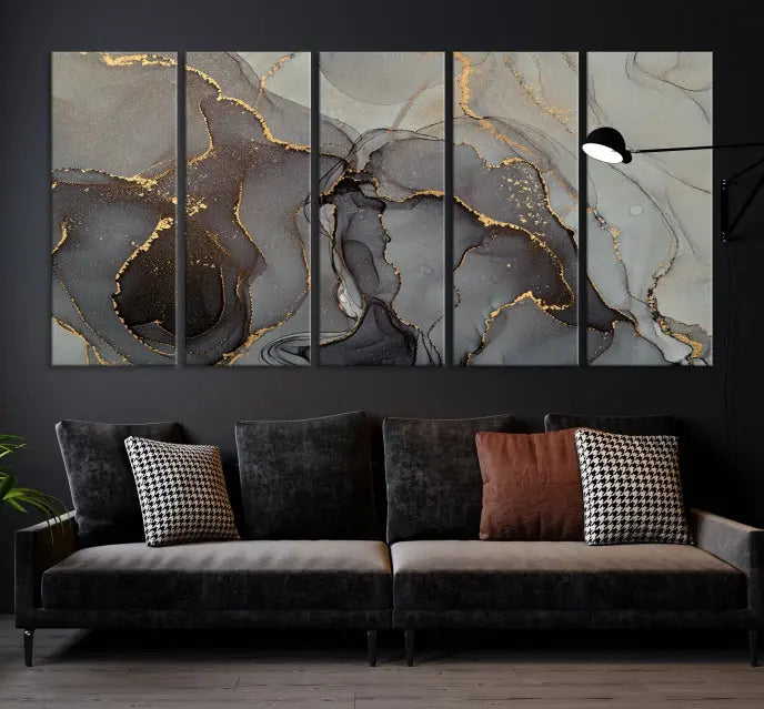 The Gray Marble Fluid Effect Wall Art Abstract Canvas Wall Art Print is a museum-quality canvas featuring triptych abstract art with swirling gray and gold patterns. Complete with a UV-protective coating, this piece of artwork arrives ready to hang, effortlessly elevating your living space.