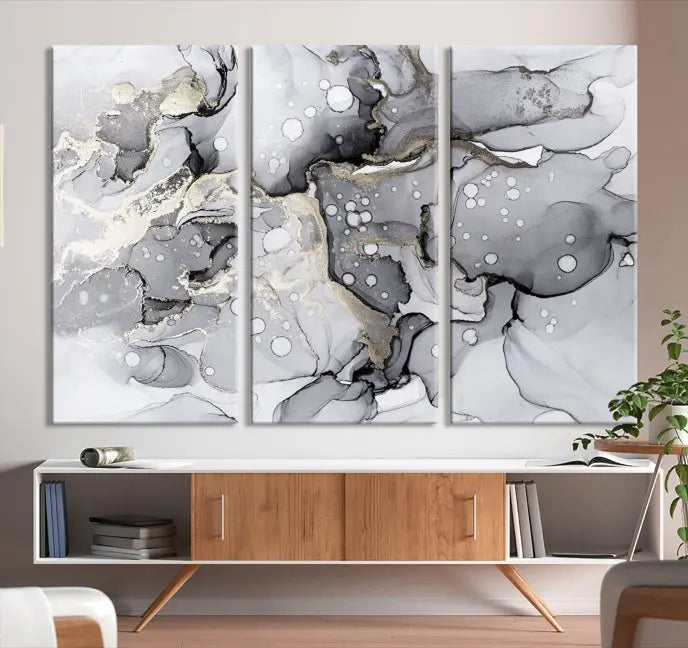 A modern living room features the Gray Marble Fluid Effect Wall Art Abstract Canvas Wall Art Print above the black wall, providing a timeless touch.