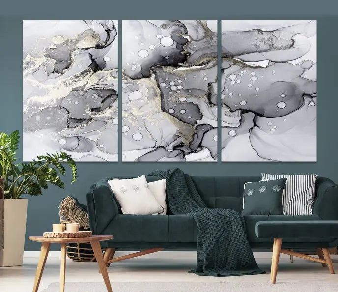 A modern living room features the Gray Marble Fluid Effect Wall Art Abstract Canvas Wall Art Print above the black wall, providing a timeless touch.