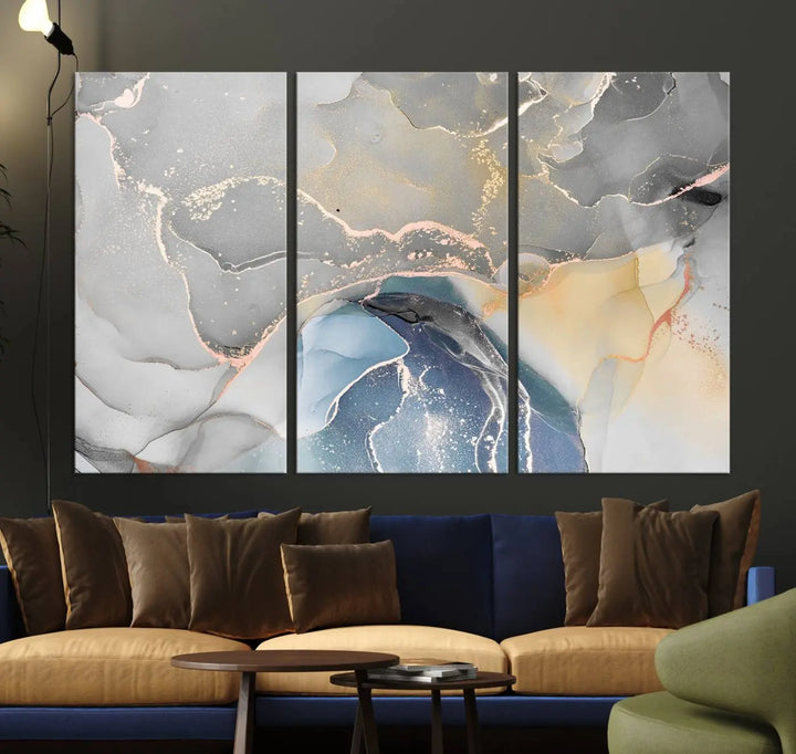 The Gray Marble Fluid Effect Wall Art Abstract Canvas Wall Art Print features elegant gold, blue, and gray hues. Crafted on museum-quality canvas, it includes a UV-protective coating for enduring vibrance. Enjoy the added benefit of free shipping.