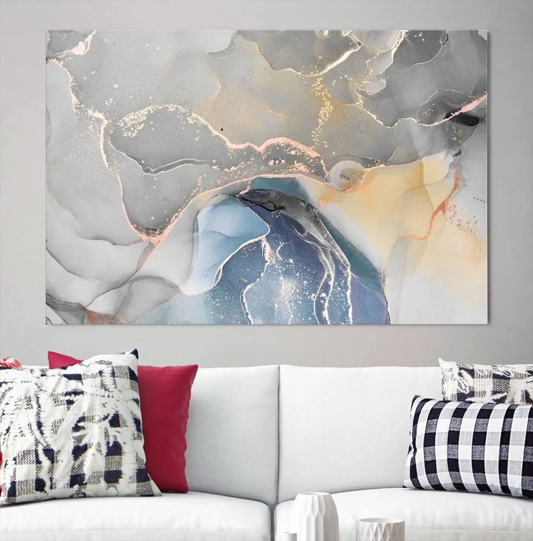 The Gray Marble Fluid Effect Wall Art Abstract Canvas Wall Art Print features elegant gold, blue, and gray hues. Crafted on museum-quality canvas, it includes a UV-protective coating for enduring vibrance. Enjoy the added benefit of free shipping.