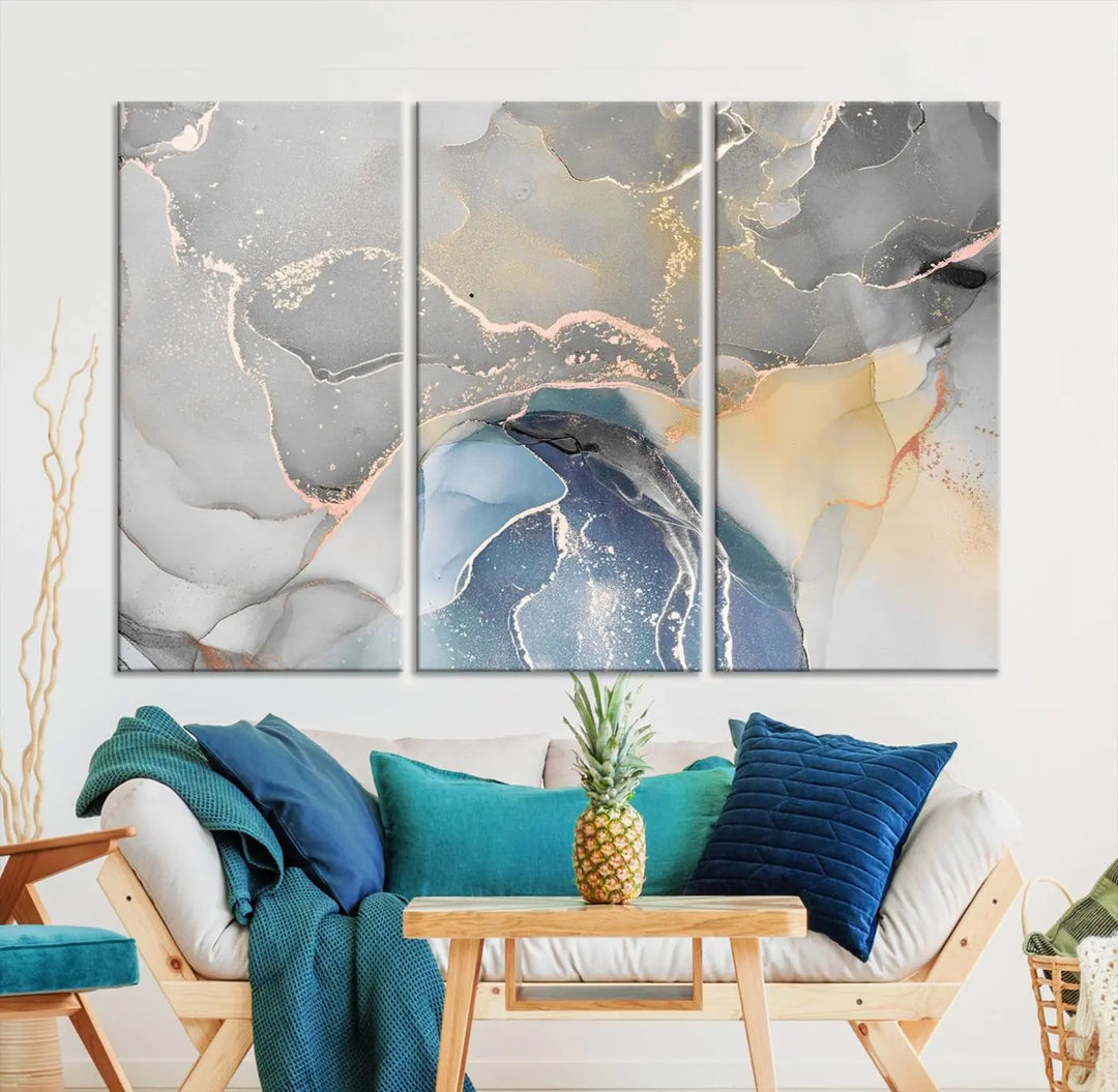 The Gray Marble Fluid Effect Wall Art Abstract Canvas Wall Art Print features elegant gold, blue, and gray hues. Crafted on museum-quality canvas, it includes a UV-protective coating for enduring vibrance. Enjoy the added benefit of free shipping.