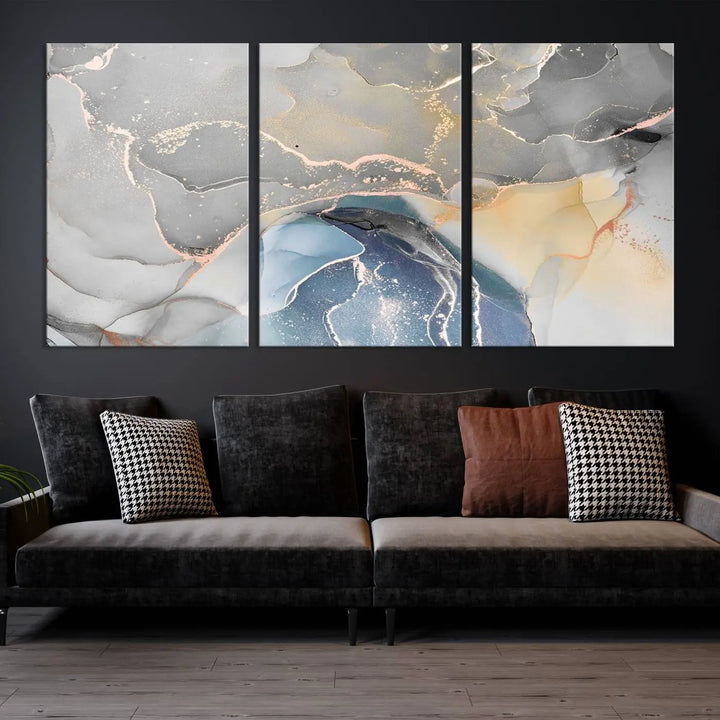 The Gray Marble Fluid Effect Wall Art Abstract Canvas Wall Art Print features elegant gold, blue, and gray hues. Crafted on museum-quality canvas, it includes a UV-protective coating for enduring vibrance. Enjoy the added benefit of free shipping.