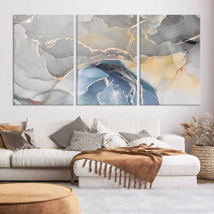 The Gray Marble Fluid Effect Wall Art Abstract Canvas Wall Art Print features elegant gold, blue, and gray hues. Crafted on museum-quality canvas, it includes a UV-protective coating for enduring vibrance. Enjoy the added benefit of free shipping.