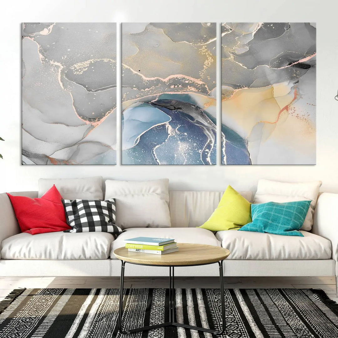 The Gray Marble Fluid Effect Wall Art Abstract Canvas Wall Art Print features elegant gold, blue, and gray hues. Crafted on museum-quality canvas, it includes a UV-protective coating for enduring vibrance. Enjoy the added benefit of free shipping.