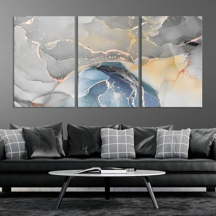 The Gray Marble Fluid Effect Wall Art Abstract Canvas Wall Art Print features elegant gold, blue, and gray hues. Crafted on museum-quality canvas, it includes a UV-protective coating for enduring vibrance. Enjoy the added benefit of free shipping.