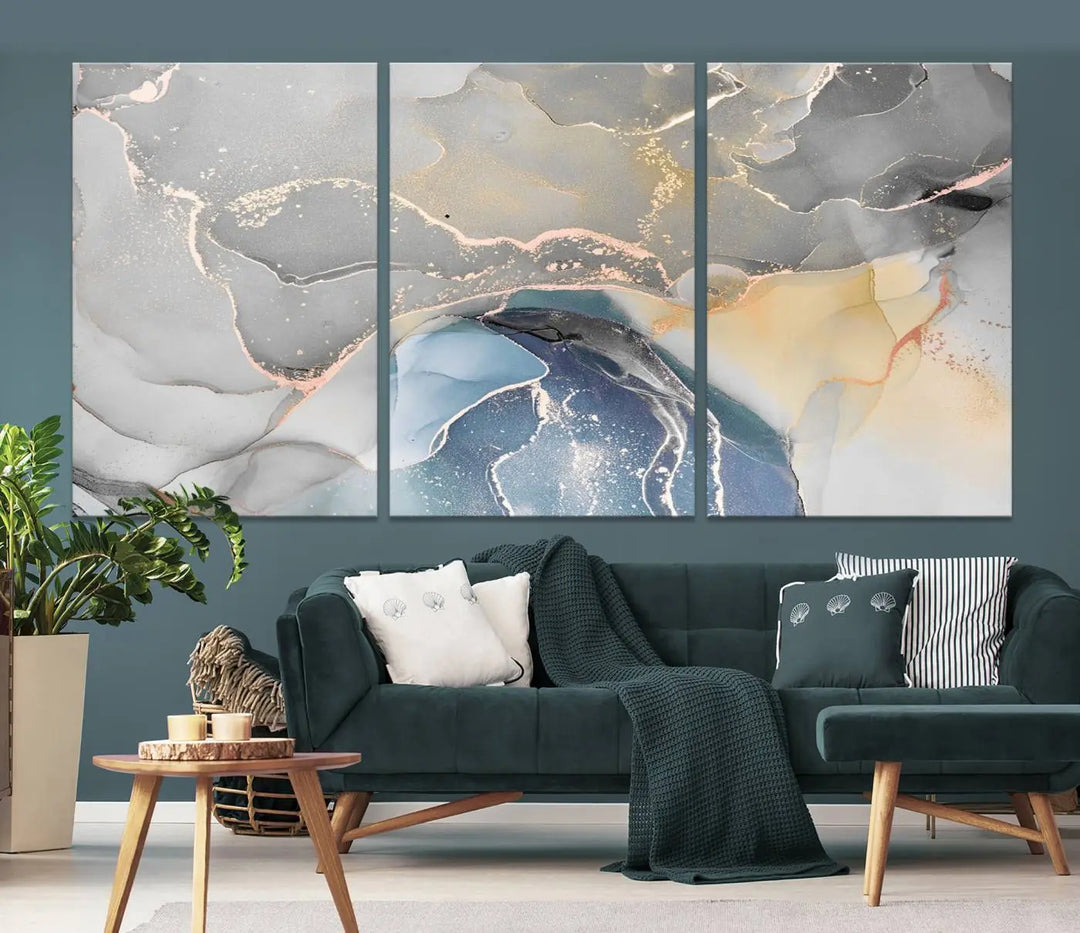 The Gray Marble Fluid Effect Wall Art Abstract Canvas Wall Art Print features elegant gold, blue, and gray hues. Crafted on museum-quality canvas, it includes a UV-protective coating for enduring vibrance. Enjoy the added benefit of free shipping.