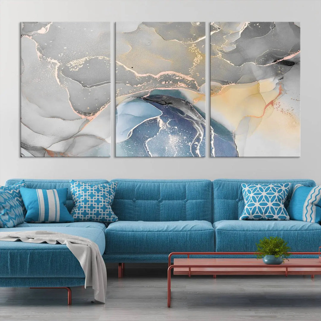 The Gray Marble Fluid Effect Wall Art Abstract Canvas Wall Art Print features elegant gold, blue, and gray hues. Crafted on museum-quality canvas, it includes a UV-protective coating for enduring vibrance. Enjoy the added benefit of free shipping.