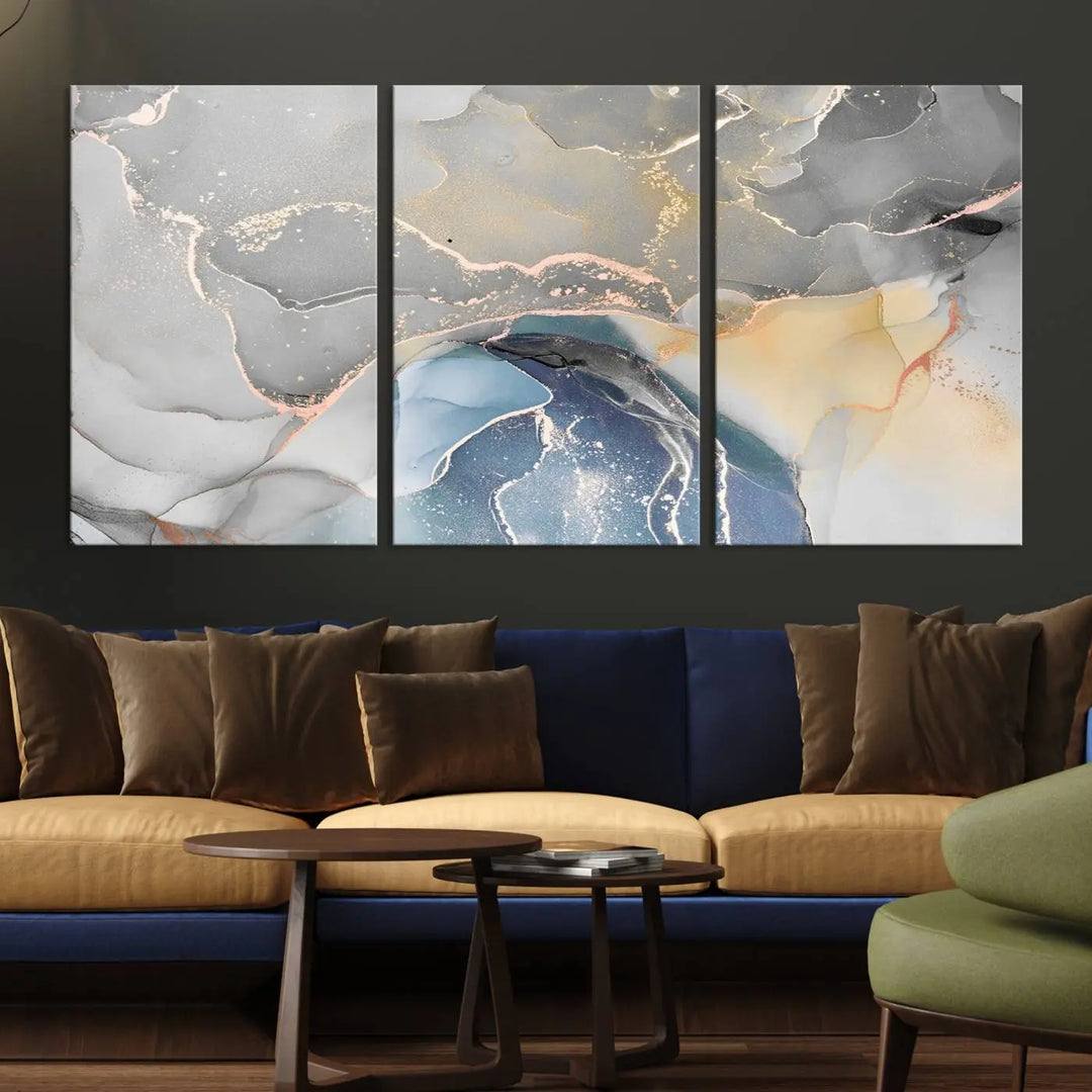 The Gray Marble Fluid Effect Wall Art Abstract Canvas Wall Art Print features elegant gold, blue, and gray hues. Crafted on museum-quality canvas, it includes a UV-protective coating for enduring vibrance. Enjoy the added benefit of free shipping.