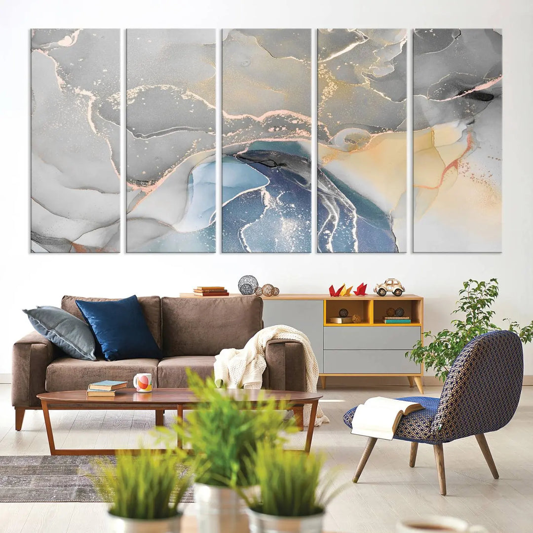 The Gray Marble Fluid Effect Wall Art Abstract Canvas Wall Art Print features elegant gold, blue, and gray hues. Crafted on museum-quality canvas, it includes a UV-protective coating for enduring vibrance. Enjoy the added benefit of free shipping.