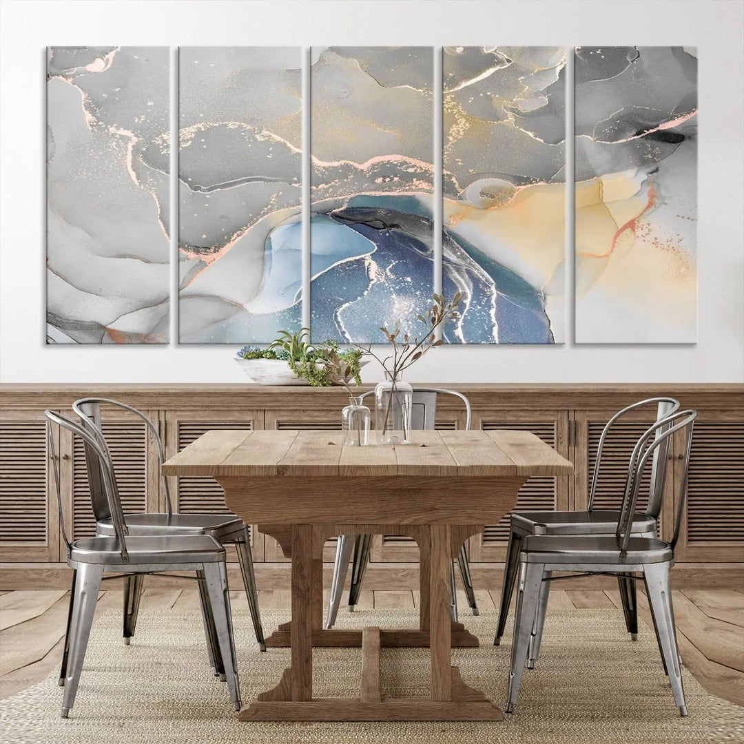 The Gray Marble Fluid Effect Wall Art Abstract Canvas Wall Art Print features elegant gold, blue, and gray hues. Crafted on museum-quality canvas, it includes a UV-protective coating for enduring vibrance. Enjoy the added benefit of free shipping.