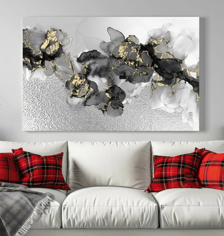 The Gray Marble Fluid Effect Wall Art Abstract Canvas Print, featuring black, white, and gold textured patterns, is crafted on museum-quality canvases and finished with a UV-protective coating. This piece adds sophistication to any space.