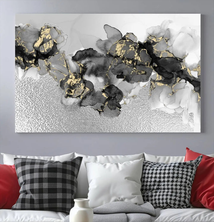 The Gray Marble Fluid Effect Wall Art Abstract Canvas Print, featuring black, white, and gold textured patterns, is crafted on museum-quality canvases and finished with a UV-protective coating. This piece adds sophistication to any space.