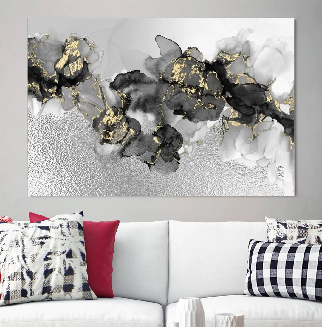 The Gray Marble Fluid Effect Wall Art Abstract Canvas Print, featuring black, white, and gold textured patterns, is crafted on museum-quality canvases and finished with a UV-protective coating. This piece adds sophistication to any space.