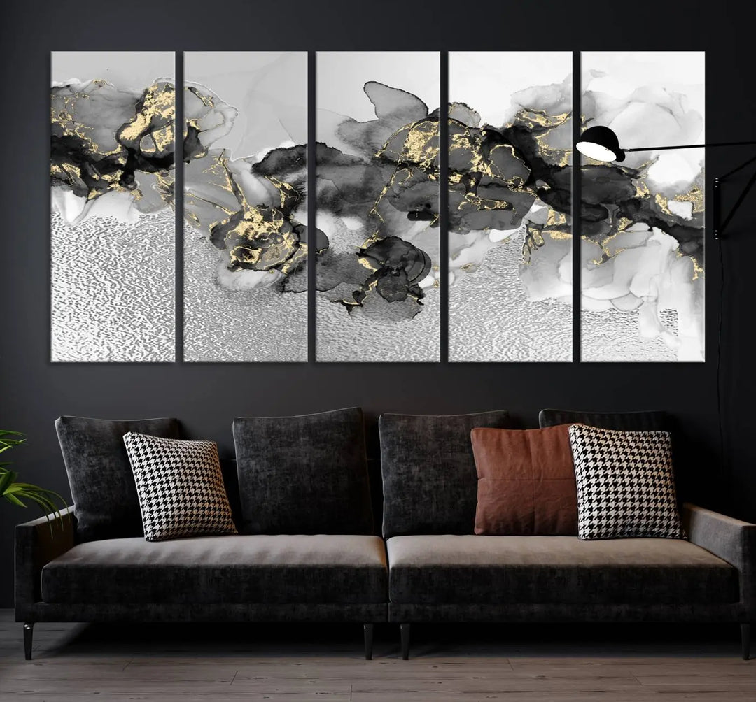 The Gray Marble Fluid Effect Wall Art Abstract Canvas Print, featuring black, white, and gold textured patterns, is crafted on museum-quality canvases and finished with a UV-protective coating. This piece adds sophistication to any space.