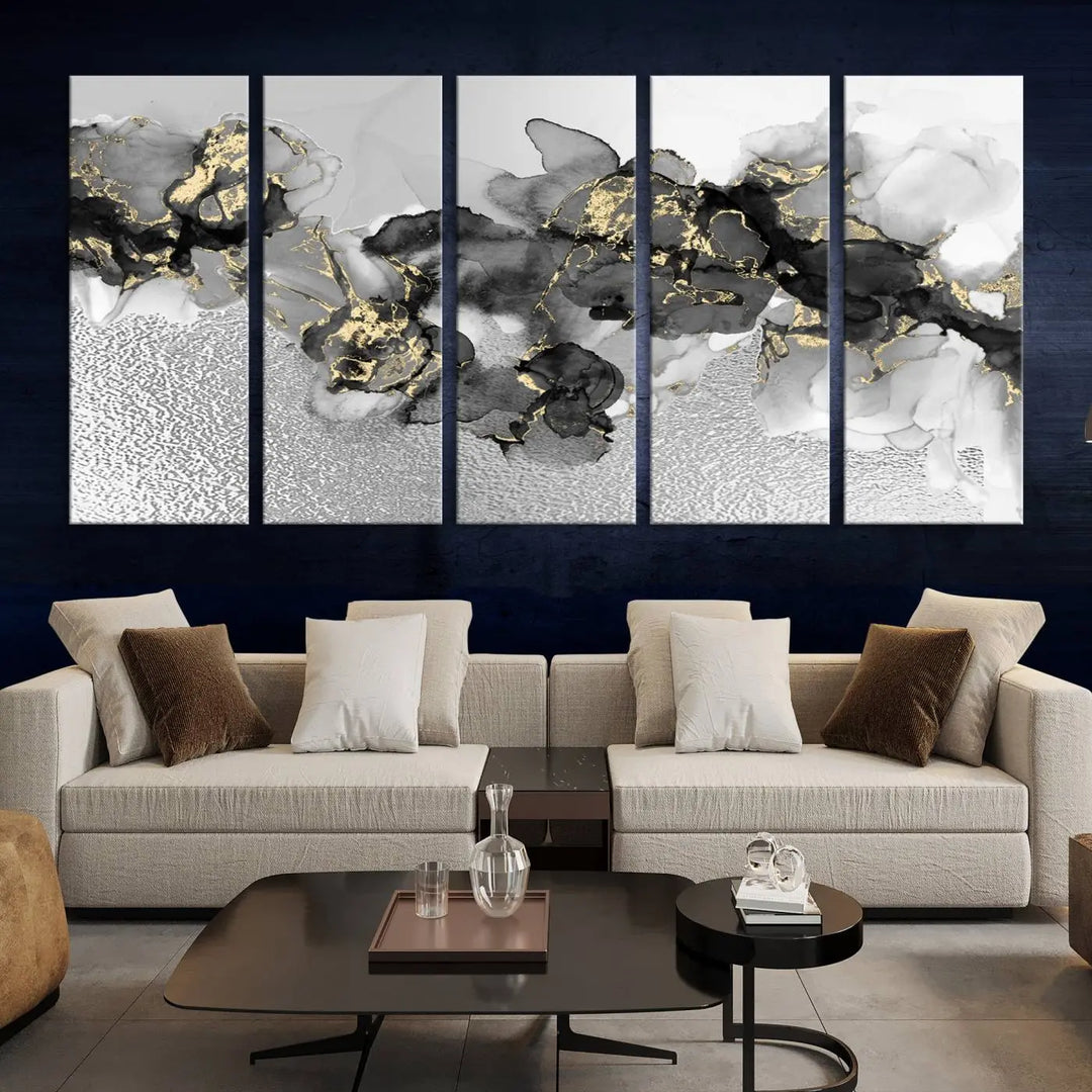 The Gray Marble Fluid Effect Wall Art Abstract Canvas Print, featuring black, white, and gold textured patterns, is crafted on museum-quality canvases and finished with a UV-protective coating. This piece adds sophistication to any space.