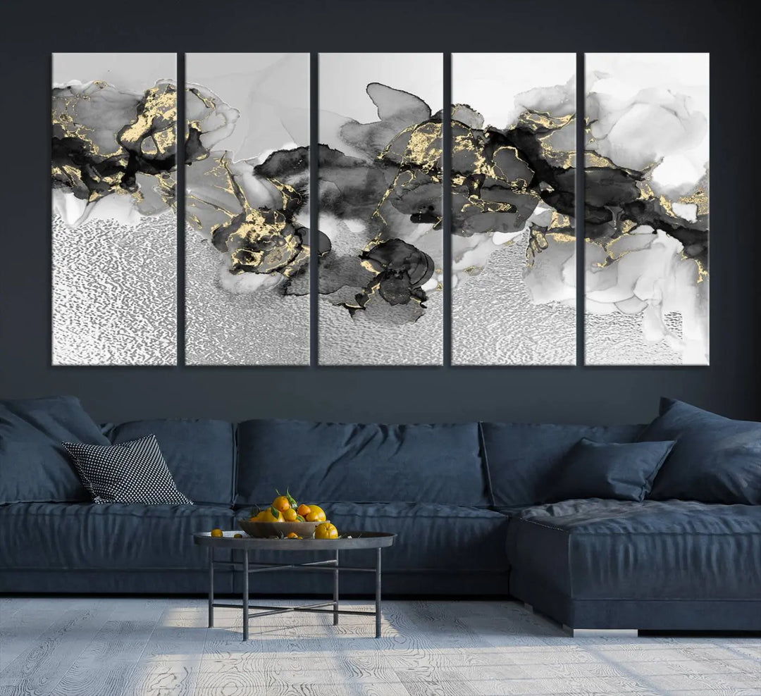 The Gray Marble Fluid Effect Wall Art Abstract Canvas Print, featuring black, white, and gold textured patterns, is crafted on museum-quality canvases and finished with a UV-protective coating. This piece adds sophistication to any space.