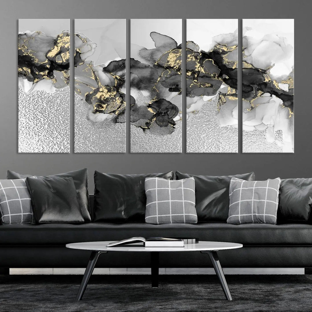 The Gray Marble Fluid Effect Wall Art Abstract Canvas Print, featuring black, white, and gold textured patterns, is crafted on museum-quality canvases and finished with a UV-protective coating. This piece adds sophistication to any space.