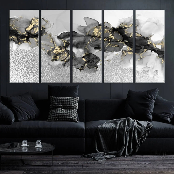 The Gray Marble Fluid Effect Wall Art Abstract Canvas Print, featuring black, white, and gold textured patterns, is crafted on museum-quality canvases and finished with a UV-protective coating. This piece adds sophistication to any space.