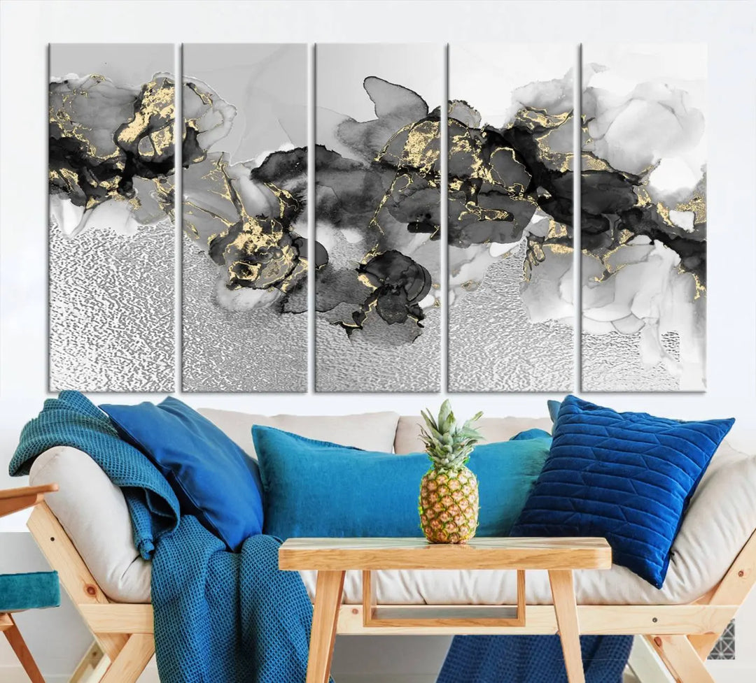 The Gray Marble Fluid Effect Wall Art Abstract Canvas Print, featuring black, white, and gold textured patterns, is crafted on museum-quality canvases and finished with a UV-protective coating. This piece adds sophistication to any space.