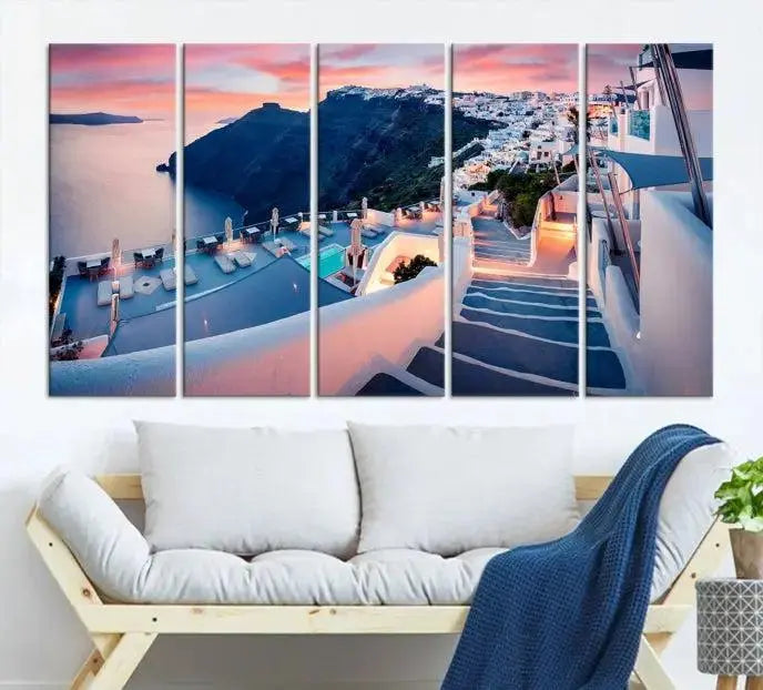 Greece Santorini Wall Art Landscape Canvas Print showcases a coastal village at sunset, featuring white buildings and an ocean view. The gallery-wrapped image is printed on museum-quality canvas for lasting beauty.